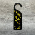 3D printed Shhhh Do Not Disturb door knob sign hanging on a door handle, made in Brisbane Australia
