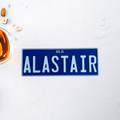 Blue sign with 'ALASTAIR' on a white surface with a glass of tea PPQ old 3d print