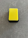 Yellow sponge on a gray surface on a 3d printed tray