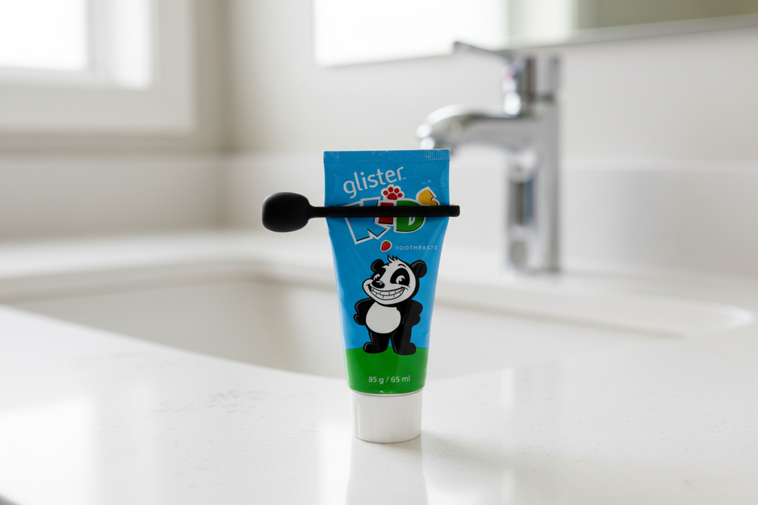 toothpaste tube with panda design on a bathroom counter and squeezer
