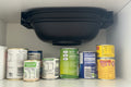 Varoma fixture above a shelf with canned goods.