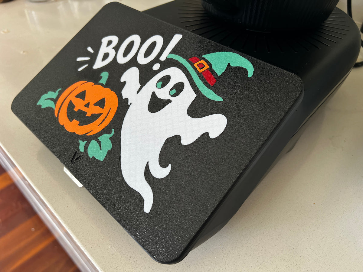 Boo! ghost Halloween screen cover on a Thermomix TM7 — white ghost in a teal witch hat beside a jack-o'-lantern, 3D printed on black