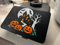 Haunted house Halloween screen cover on a Thermomix TM7 — full moon, crooked house with glowing orange windows, bats, bare tree and three jack-o'-lanterns