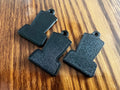 Back view of three Thermomix TM7 keychains