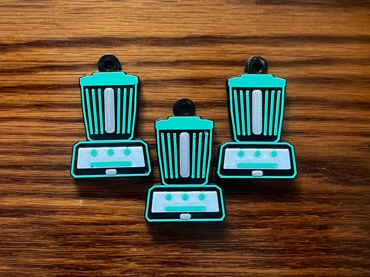 Three Thermomix TM7 keychains displayed together